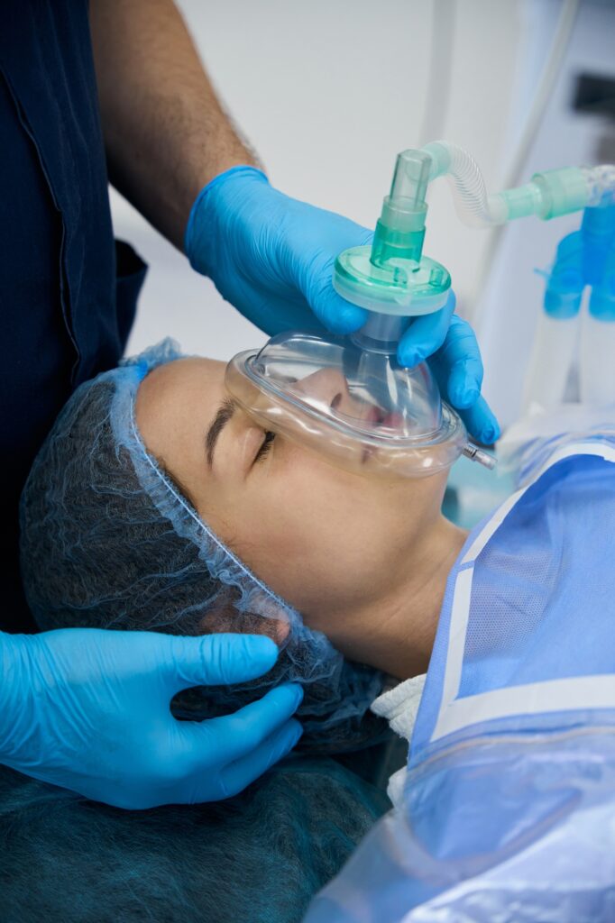 Woman under anesthesia on the operating table